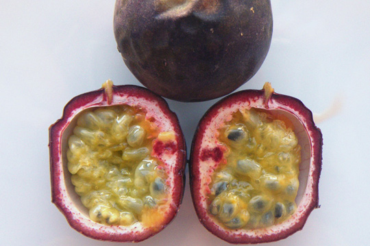  a pink and yellow opened gulupa, a passionfruit from Colombia