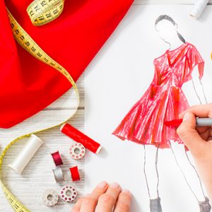 Top fashion designers drawing a new design - Get to know Colombian top fashion designers | Colombia Country Brand