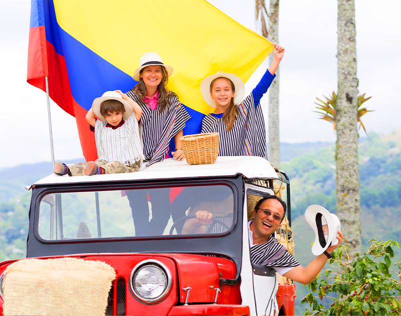 Colombian people always give a welcome celebrating in family– A Colombian family celebrating in a jeep | Colombia Country Brand