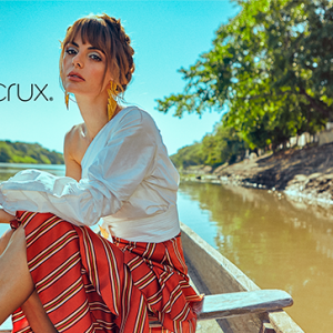 A woman on a boat wearing Colombian Jewelry brand, Santa Crux | Colombia Country Brand