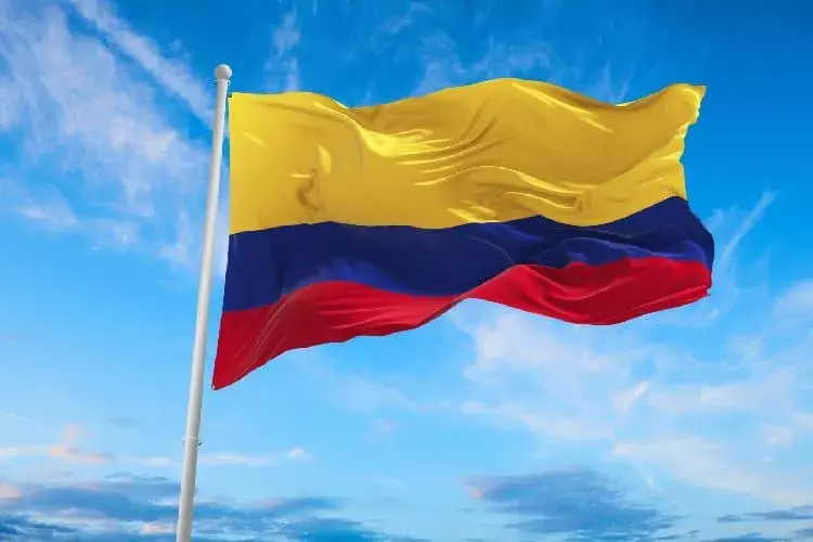 Flag of Colombia waving under a blue sky