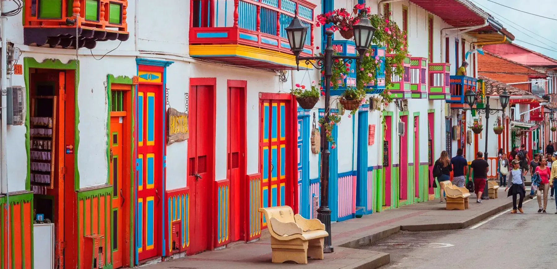 Calle Real in Salento Quindío, with colorful facades, balconies, and tourists walking