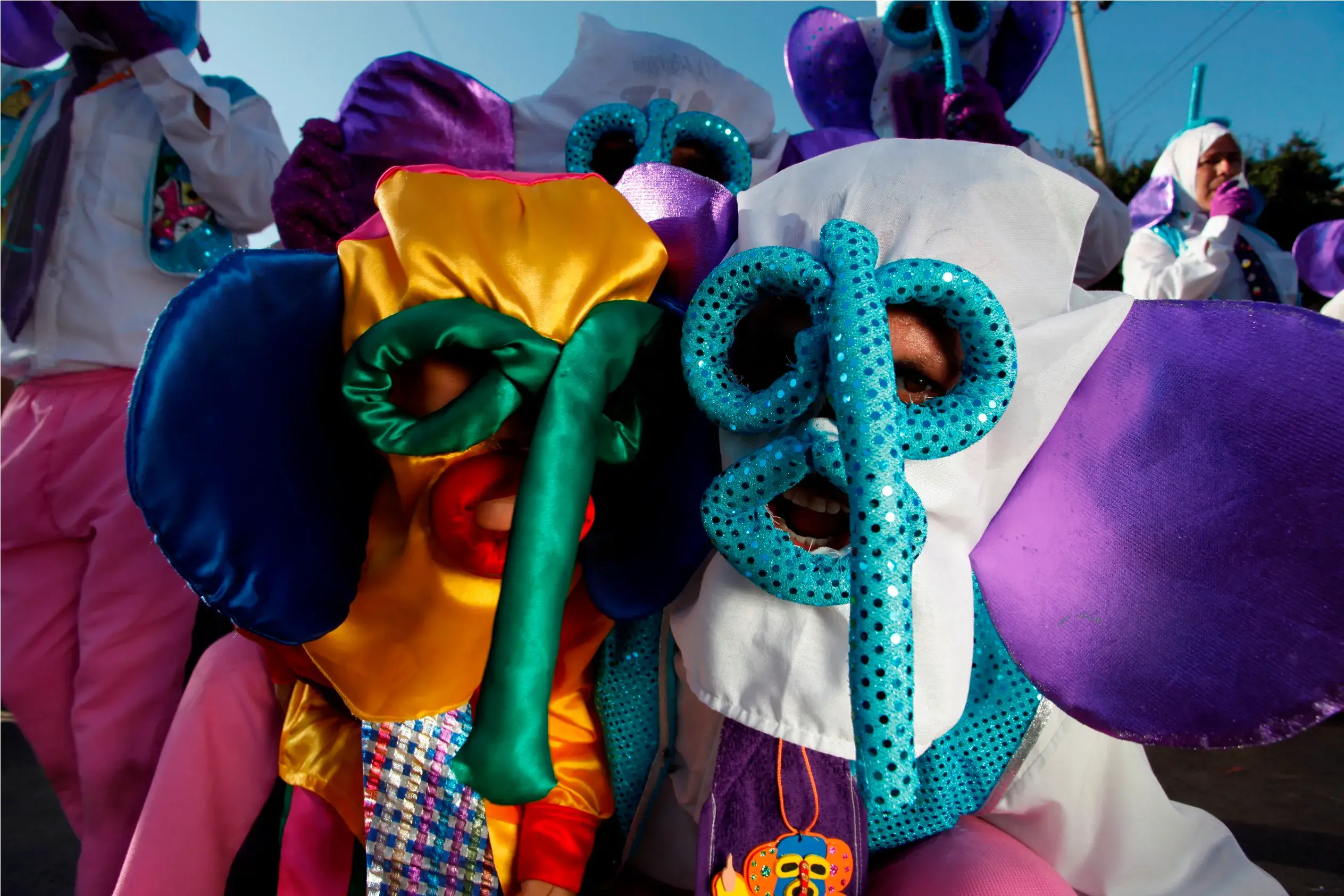 People in colorful marimonda costumes at the Barranquilla Carnival, Colombia