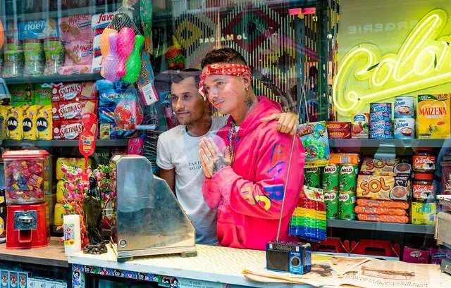 J Balvin and a friend in a Colombian neighborhood store.