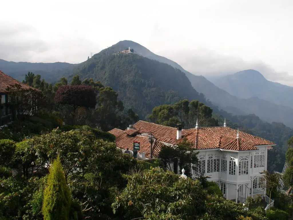 Panoramic view of Monserrate Hill and colonial house in Bogotá.