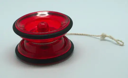 Red yo-yo with string on white background.